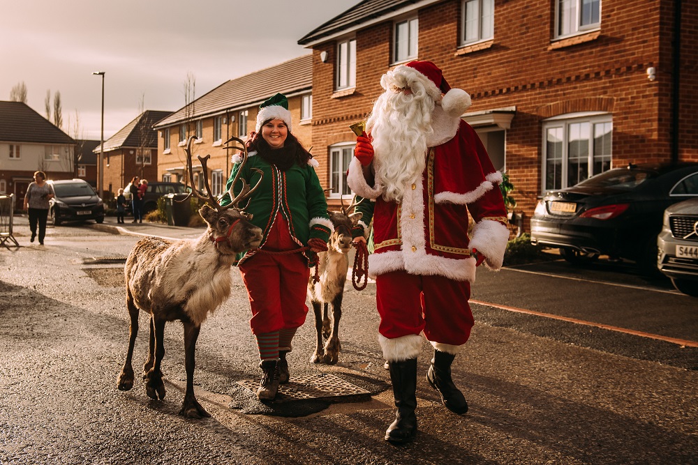 Santa with an elf and reindeer 