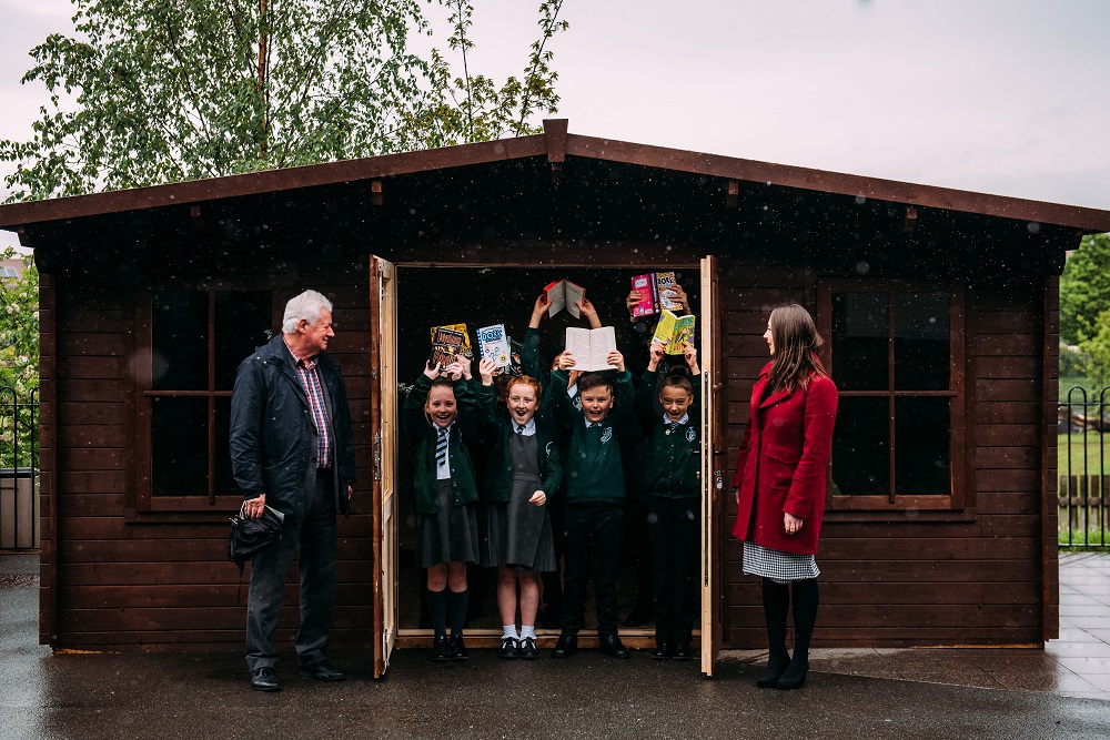 Happy children showcasing their books