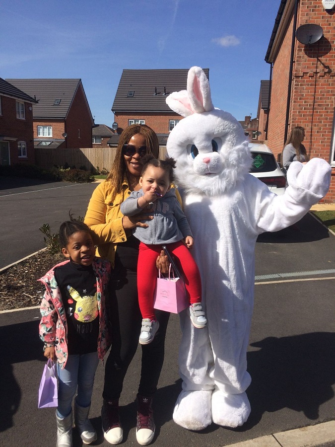 Family pose with giant Easter bunny