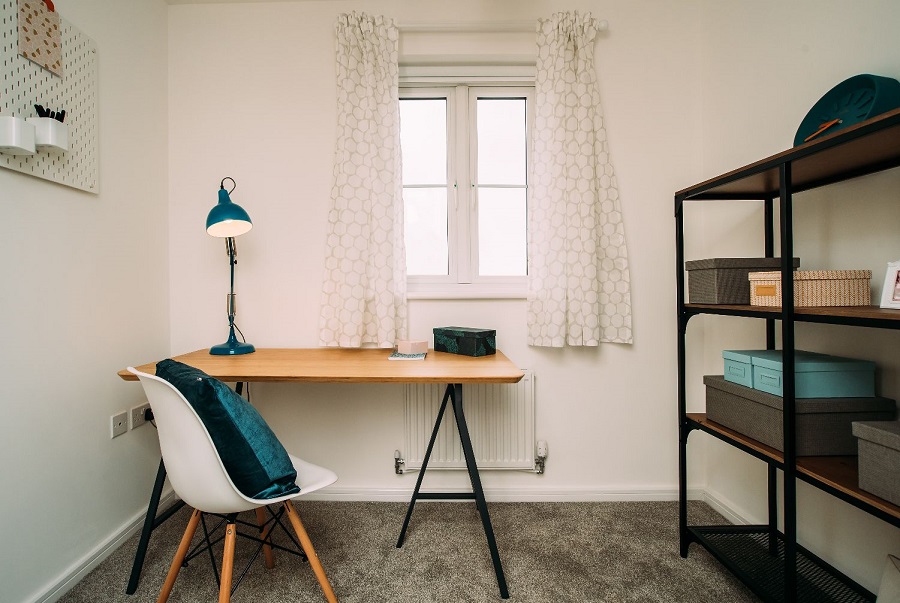 Minimalist office space with desk, chair and shelving