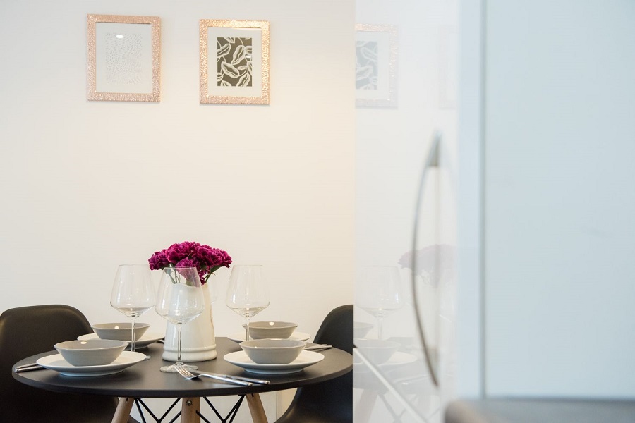 Dining room detail with vase of flowers on table