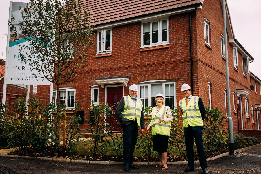 MP Mary Robinson and Simple Life directors pose outside family house in Hi-vis vests