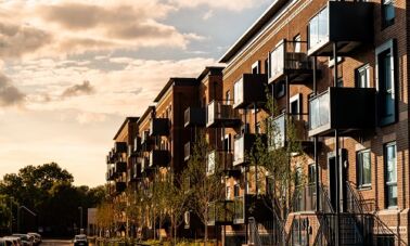 Apartment building with balconies at dusk