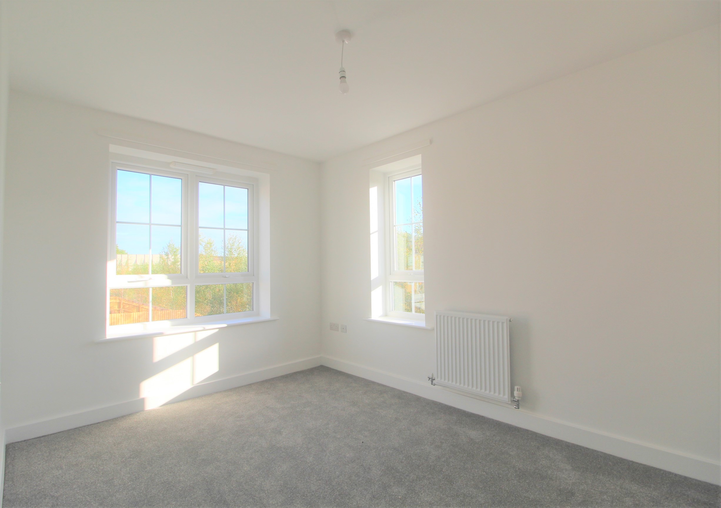 ouse carpeted bedroom