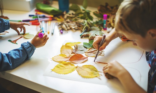 Children doing autumn handcrafts