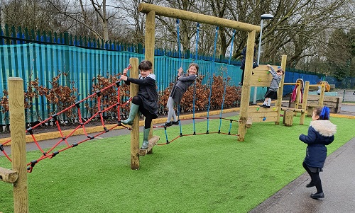 Children playing on a climbing frame