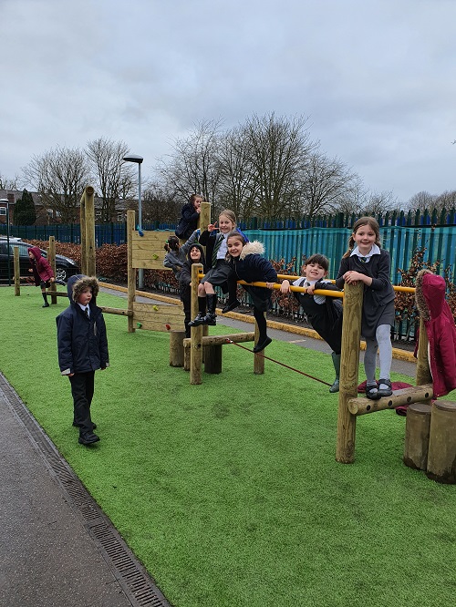 Children playing on a climbing frame