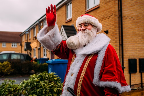 Santa Claus smiling and waving