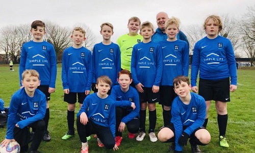 Young footballers in their Simple Life branded kit