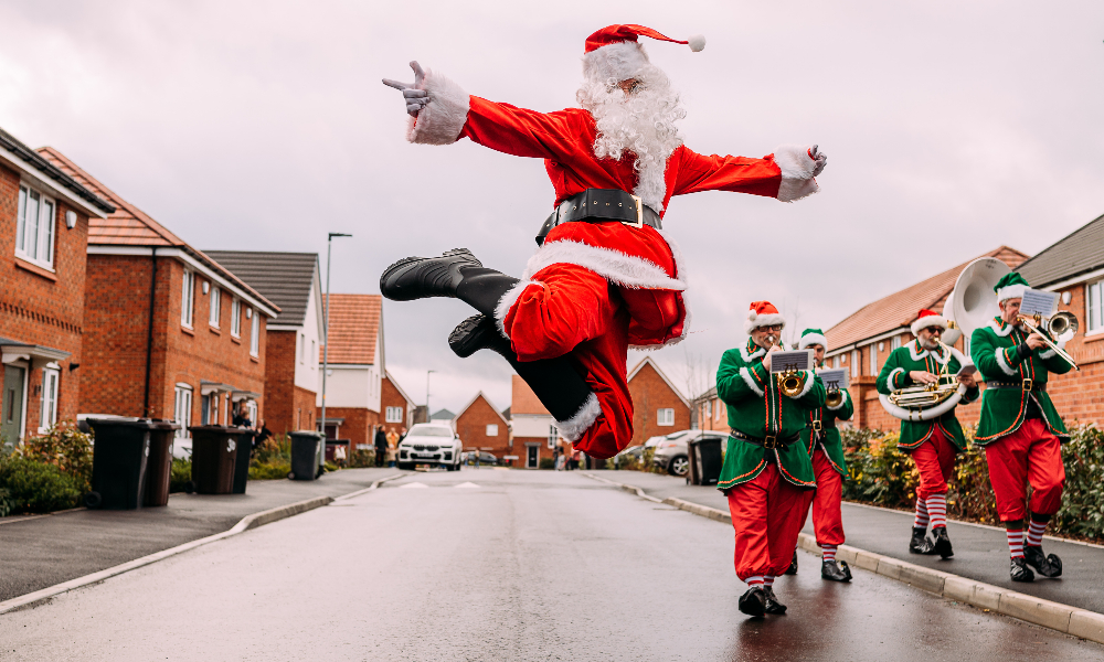 Santa Claus jumping in the middle of a road