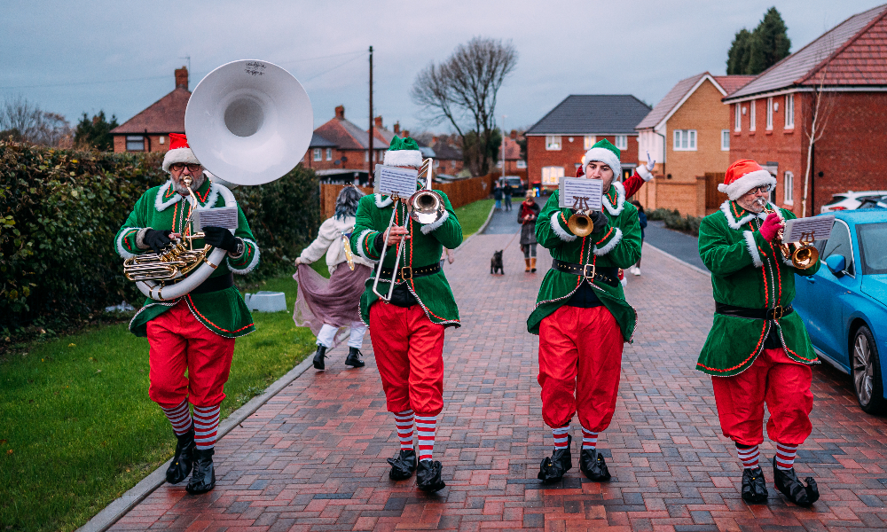 four Elves playing brass band instruments