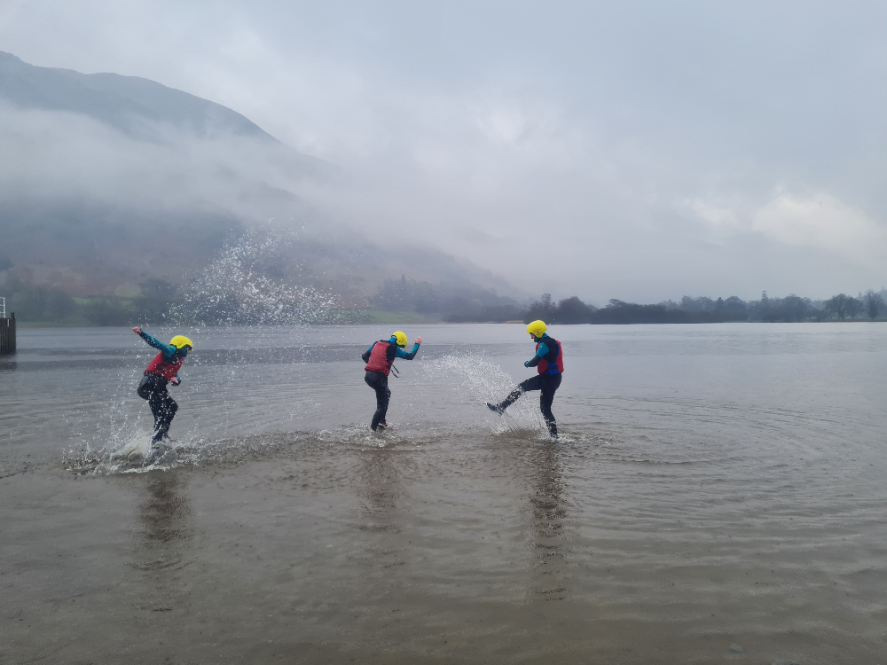 Young adults playing in the sea