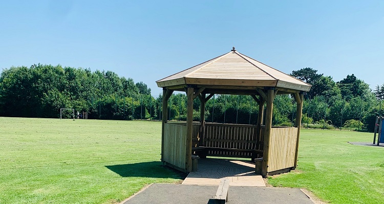 A wooden pagoda in a school field