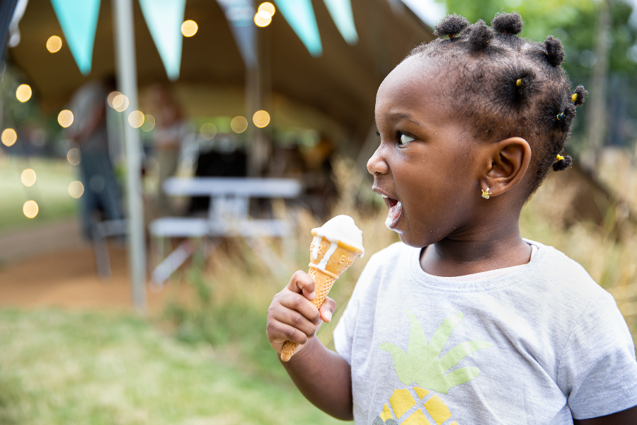 young girl licking an ice cream