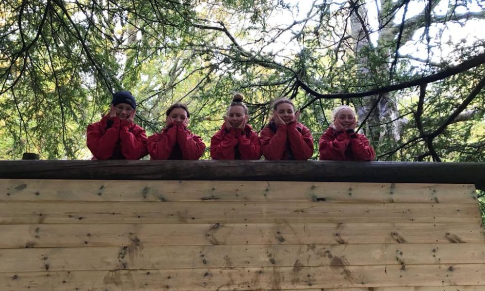 Children posting for a photo on the adventure trail