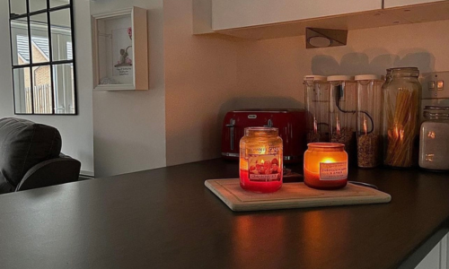 Lit candles on the kitchen counter