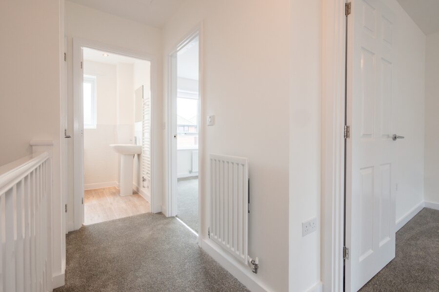 carpeted white hallway