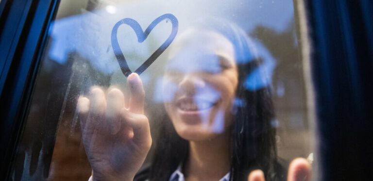 Girl Drawing a Heart in the Window - SImple Life