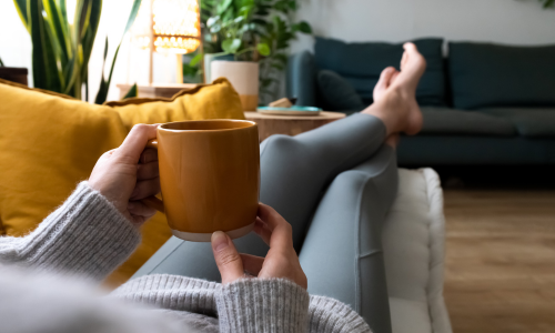 Woman relaxing with cup of tea