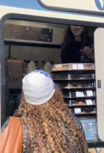 lady ordering a coffee and cake and vanoffee