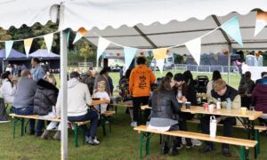 Simple Fest Gazebo, and bunting with attendees 