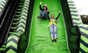 Simple Fest Event Staff going down the slide 