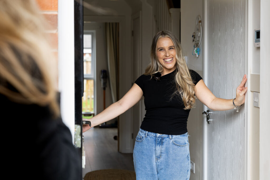 Dominika welcoming viewers into her build to rent home