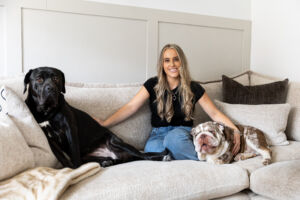Dominika and her dogs relaxing on the sofa at home