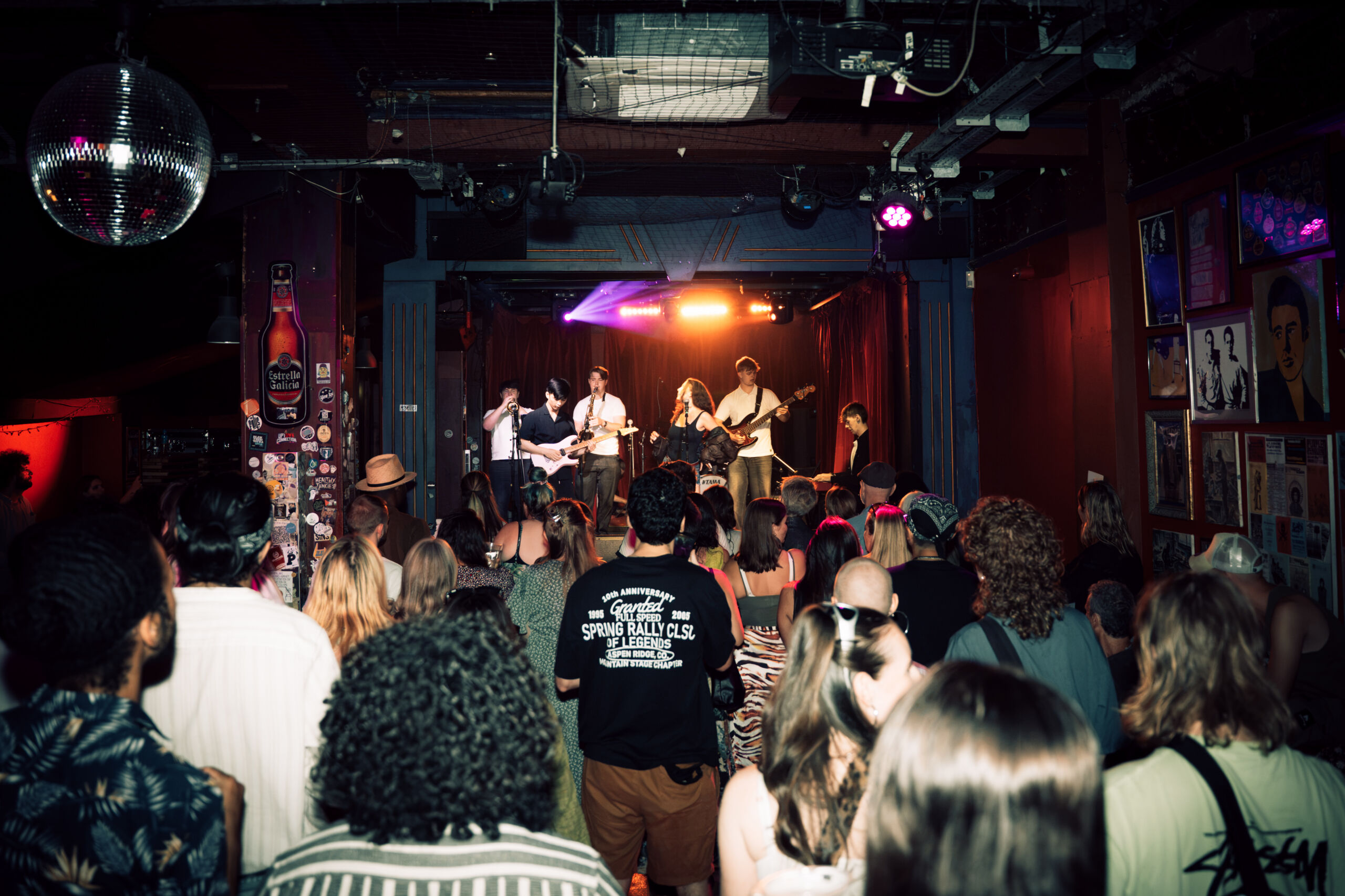 Audience watching a live performer on stage at the Simple Life Sounds event.