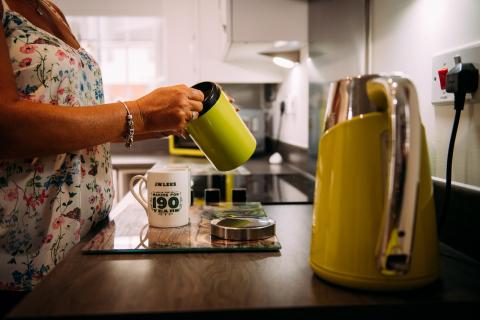 Taking coffee beans out from tin