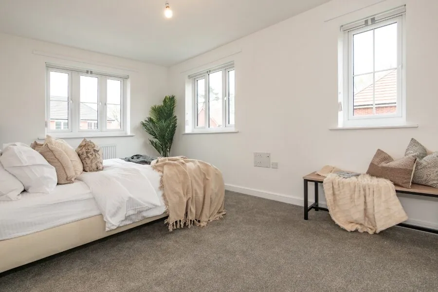 carpeted decorated bedroom
