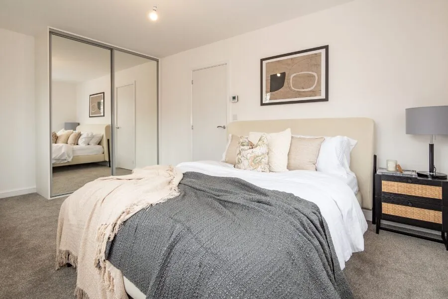 bedroom with mirrored fitted wardrobe