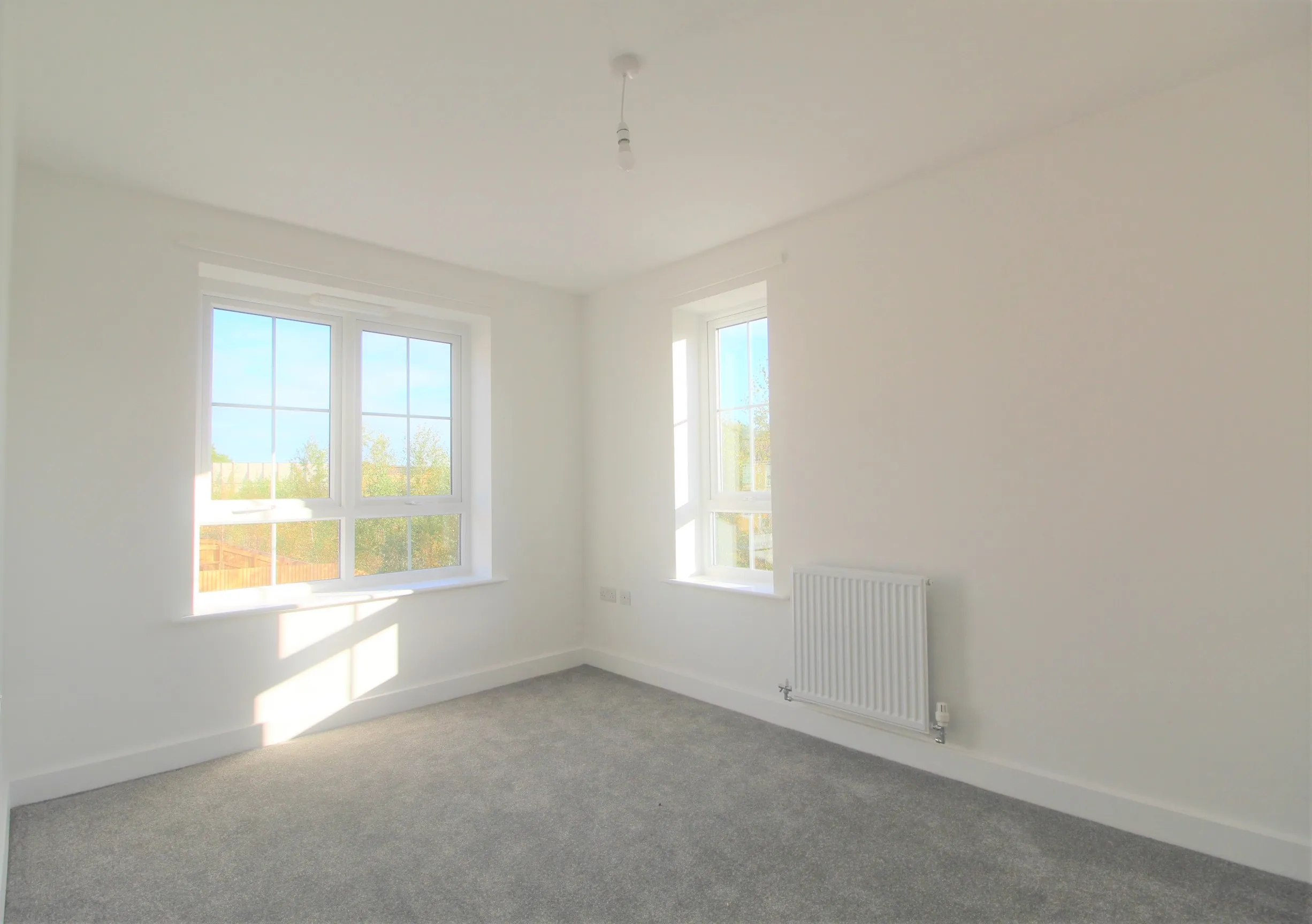 ouse carpeted bedroom