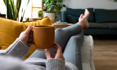 Woman relaxing with cup of tea