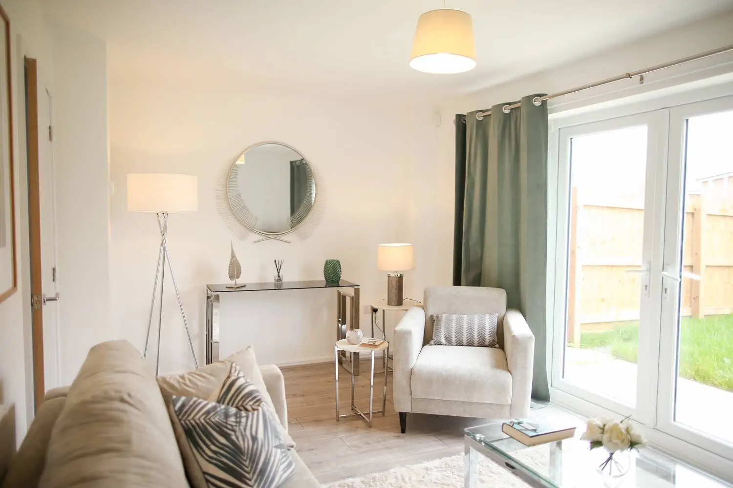 neutral living room with french patio doors to the garden