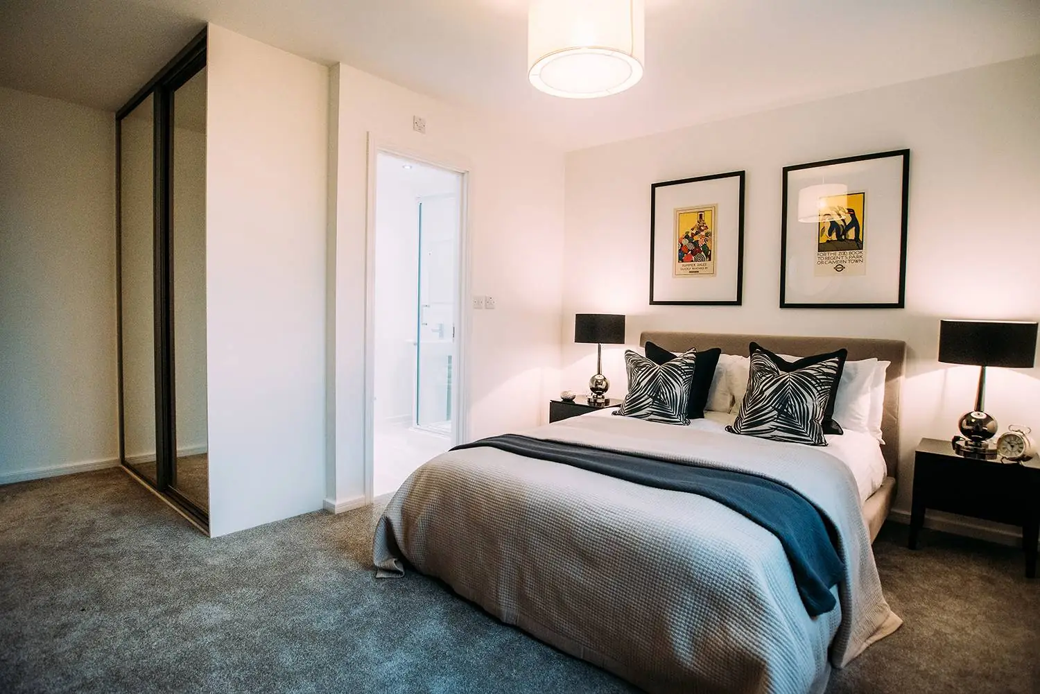 carpeted bedroom with fitted wardrobe and ensuite