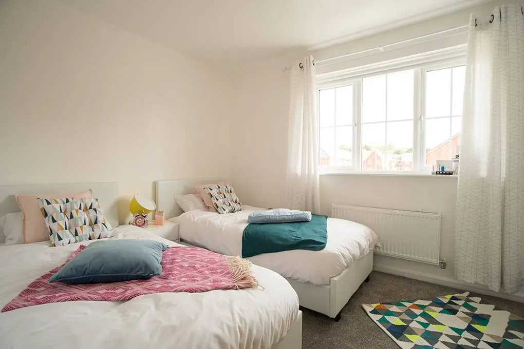 twin bed bedroom with window